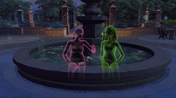 Two ghost Sims sat on a fountain in Ravenwood having a chat. One is pink, signifying she's flirty, while the other is green.