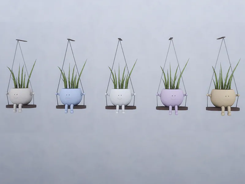 Five planters hanging on a wall, all in the same design in different colours. They're smiling planters with little hands and legs, as well as smiling faces. They have some kind of grass in them that looks like aloe vera. They're sat on swings. They're made by Violl.
