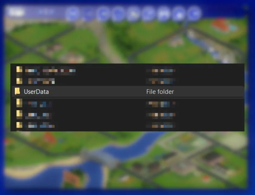 The UserData folder in The Sims 1 program files. The other items in the list are blurred except for the UserData folder. The backdrop is a blurred version of the Sims 1 neighbourhood map.