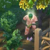 A green PlantSim with short green hair glowing and leaning down to talk to plants and mushrooms in The Sims 4. He's wearing a pink floral jumpsuit. A money tree and glow plant can be seen.