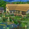 A picture of a pastoral thatched-roof cottage with a pond in the foreground.