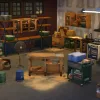 A picture of a cluttered garage-slash-workshop area with a workdesk singled out by lighting.