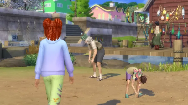 Three Sims digging and foraging in the sand and dirt in Innisgreen, one with their back to the camera wearing brightly coloured clothes, the other two kneeling down. The town area has colourful houses and stone walls.