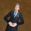 Johnny Zest lying back in the grass as an Elder in a black suit. He's stargazing.