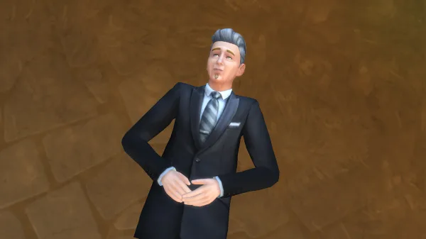 Johnny Zest lying back in the grass as an Elder in a black suit. He's stargazing.