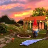 A picture of a calm rural scene with a gnome in the foreground.