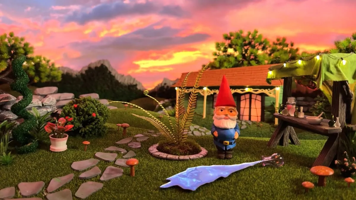A picture of a calm rural scene with a gnome in the foreground.