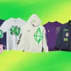 A picture of a bunch of merch lined up on a greenish-yellow background.