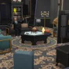 An Elder Johnny Zest playing video games in the manor in Ravenwood. The room is decorated with teal, black, and gold gothic furniture. He's wearing a tux.