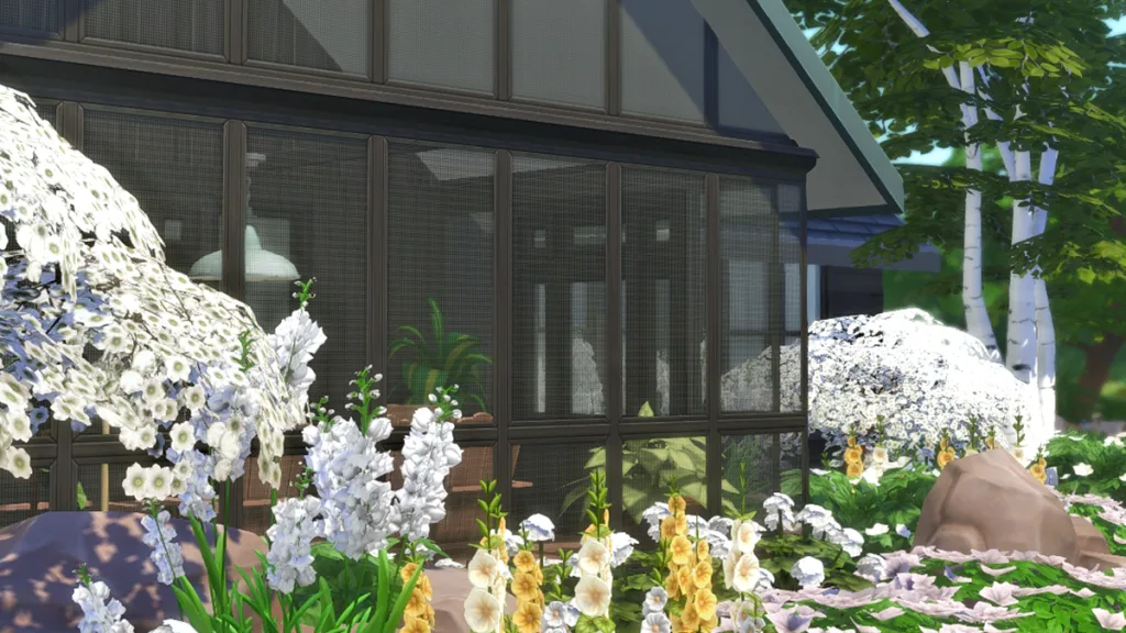 A picture of a house surrounded by flowers, with screen walls as you might see in a tropical region.
