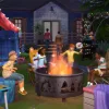 A picture of a group of kids in a backdoor camping ground with a large firepit in front of them.