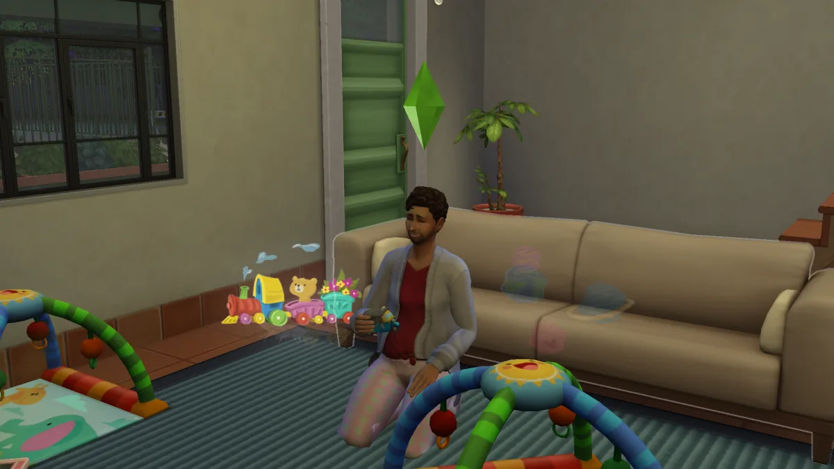 A Sim playing with toys on the ground in a neutral toned flat, showing thoughts around his head and toddler toys on the ground.