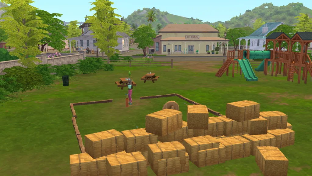 A Sim in the park in Gibbi Point, with hills and buildings around them, doing archery in front of rows of hay bales.
