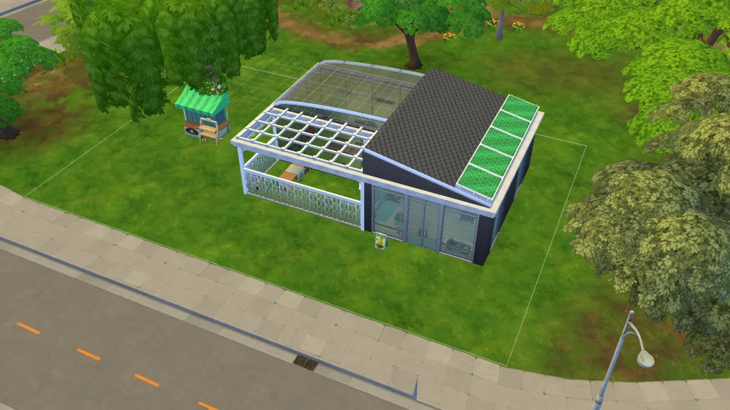 A 3/4 aerial view of a garden centre in The Sims 4 in San Sequoia. You can see a section with glass walls, a fence area, and an ara with solid walls, alongside solar panels and a flower cart.