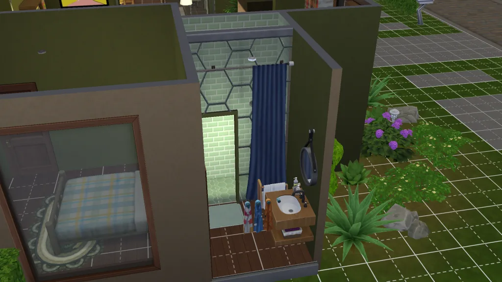 A walk-in shower in The Sims 4 using glass walls, a modular shower, and a curtain rod.