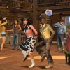 A group of people square-dancing in a barn.
