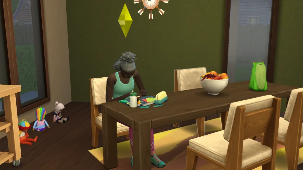 A Sim crafting with a DIY kit in the kitchen with a papier-mache frog next to them and several imaginary friends in the back. They look focussed.