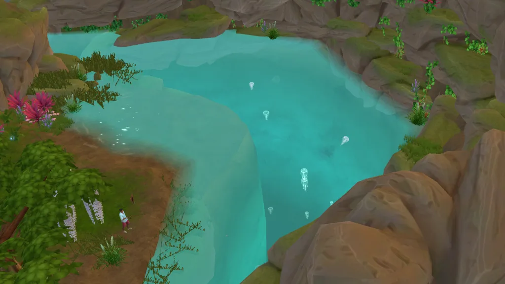 A zoomed-out shot of a rocky lagoon in The Sims 4: Adventure Awaits showing a Sim fishing in the clear waters and some little glowing jellyfish floating in the pool.