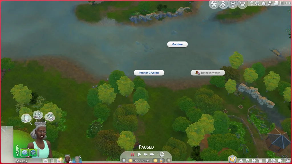 A shot showing the pan for crystals interaction and the riverbank in Gibbi Point where you can go crystal panning. It's surrounded by trees and a public garden.