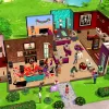 An overview of a house in The Sims Mobile, showing many rooms full of Sims doing different activitis, including talking to each other and playing music.