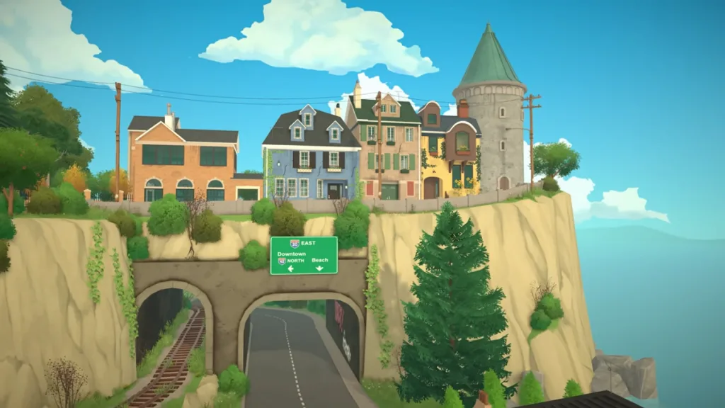 A cliff and a driving tunnel in Paralives showing old buildings, the sky, and the sea.