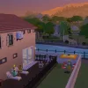 A sunset shot of a custom hotel in Tartosa in The Sims 4, showing Sims chatting on a sunlounger.