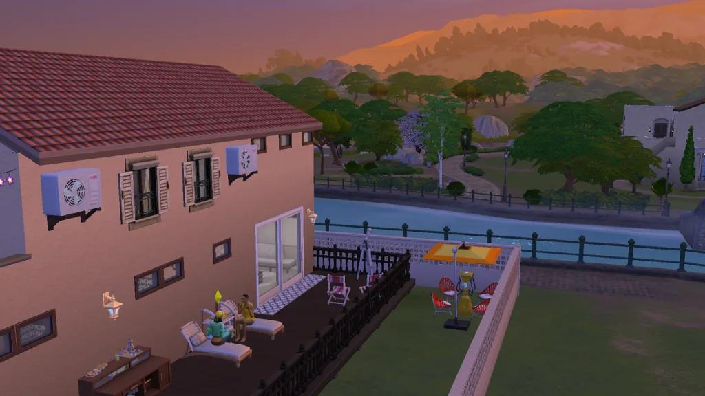 A sunset shot of a custom hotel in Tartosa in The Sims 4, showing Sims chatting on a sunlounger.