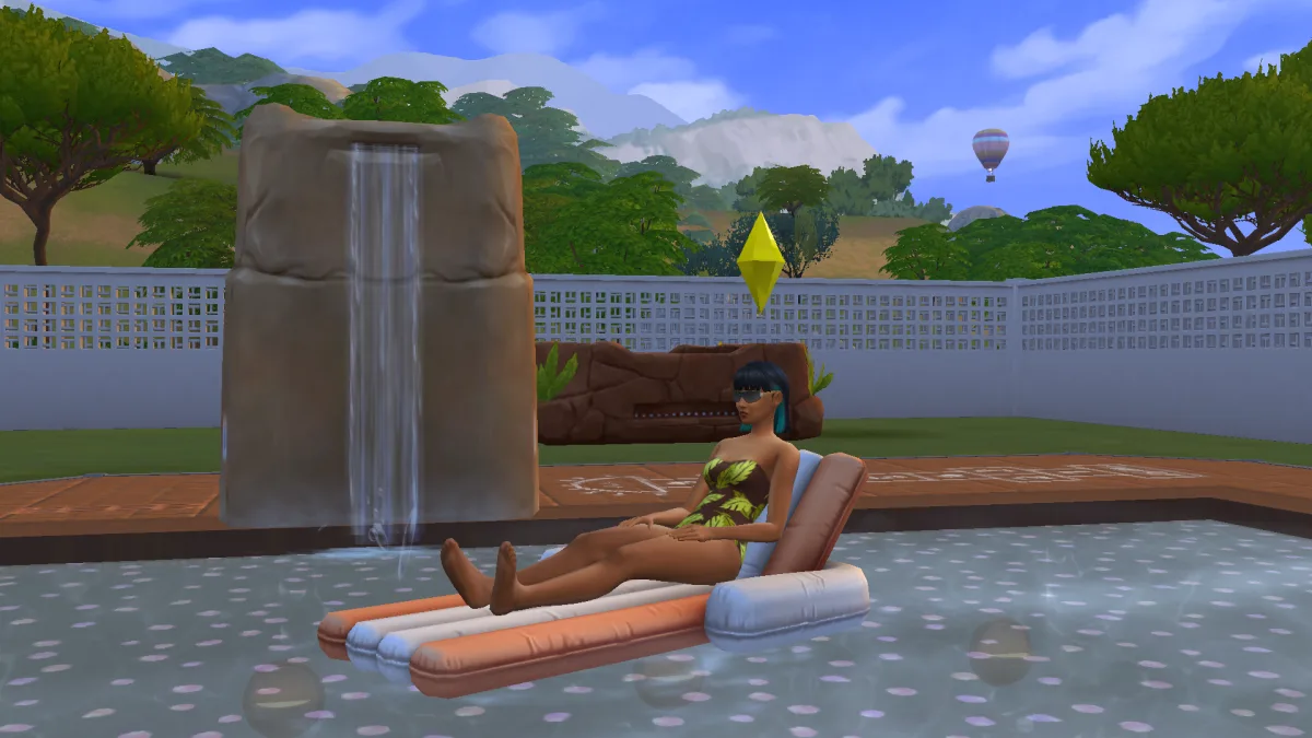 A Sim relaxing on a floatie in a large swimming pool in Tartosa on a getaway, with diving equipment and a hot air balloon behind them.